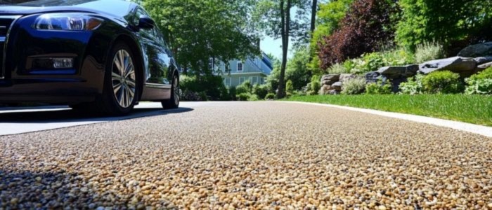 A car parked on a well-maintained chipseal driveway, showcasing the quality of driveway maintenance.