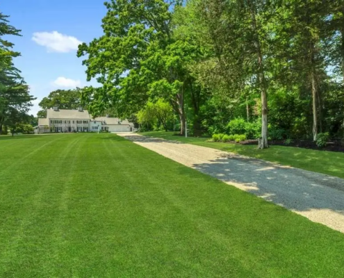 Tree-lined chip seal driveway at 181 Mountain Spring Road in Farmington, CT