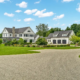 Curved chip seal driveway leading to a landscaped residential driveway in Woodstock CT