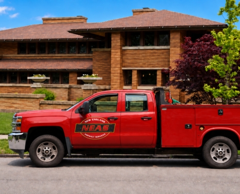 NEAS service truck parked outside Frank Lloyd Wright’s Martin House restoration project.