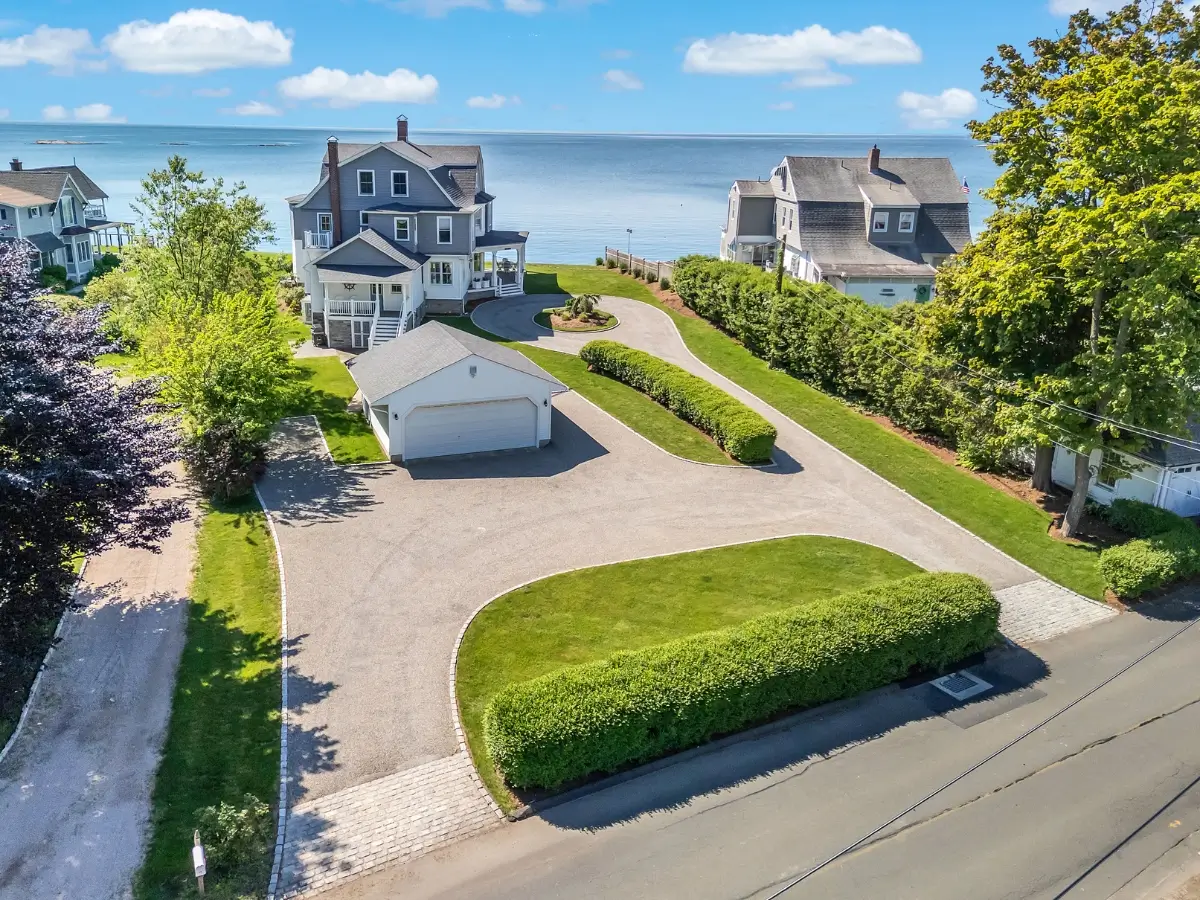 Coastal home with a well-paved asphalt driveway overlooking the ocean